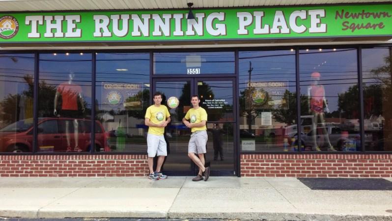 A portrait of Ken and Bill outside of The Running Place's new location.